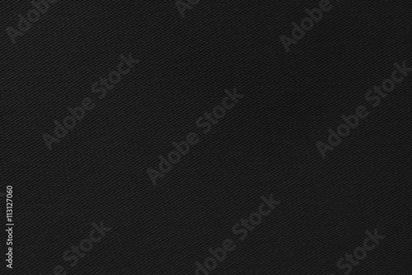 Fototapeta Black rubber. Hexagon shaped bumps look like cells.