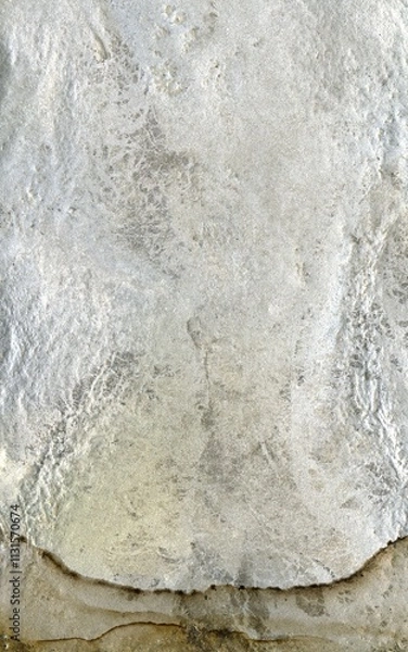 Fototapeta Close up of natural stone texture background. High resolution photo. Full frame. Abstract background and texture for design. Fossilized rock. Molten silver ingot, white metal.