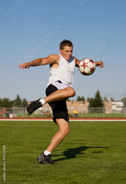 Obraz kicking a soccer ball