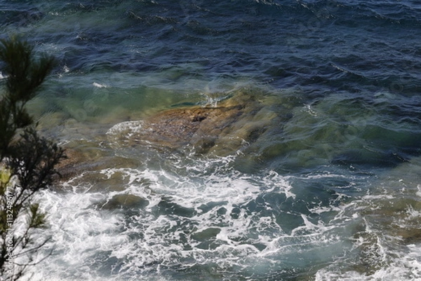 Obraz water flowing over rocks