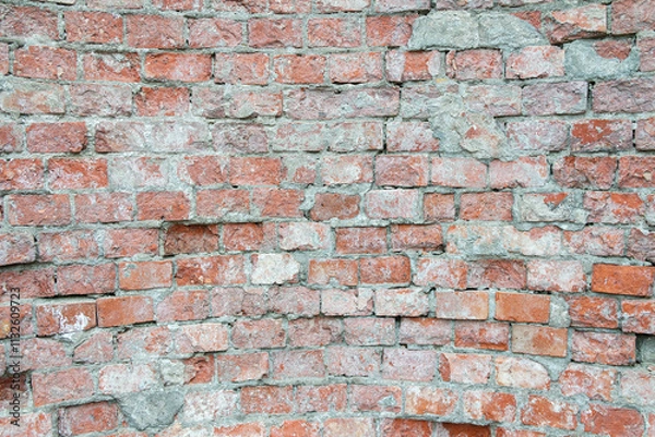 Fototapeta texture of an old brick wall with traces of destruction