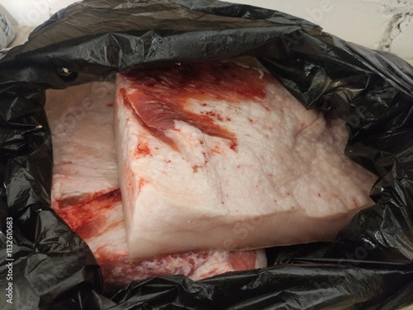 Obraz Pieces of lard in a bag in the kitchen