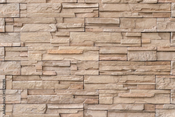Obraz Close up light brown stone wall texture background