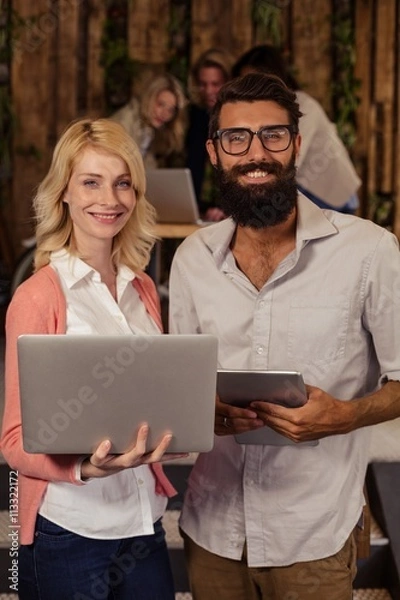 Obraz Team of hipsters using multimedia tools