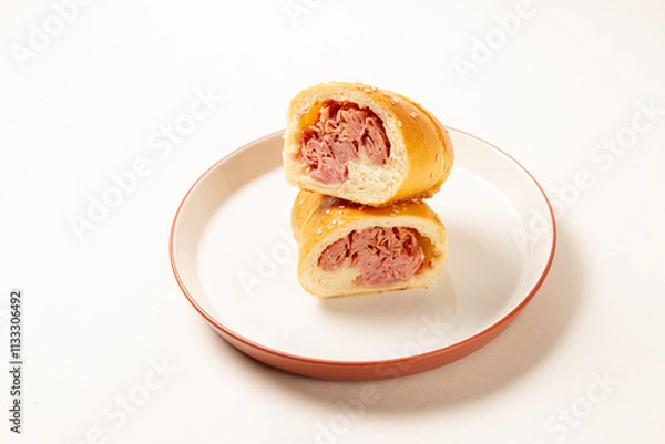 Fototapeta Cachito of ham. bread of ham, over a white plate on white background