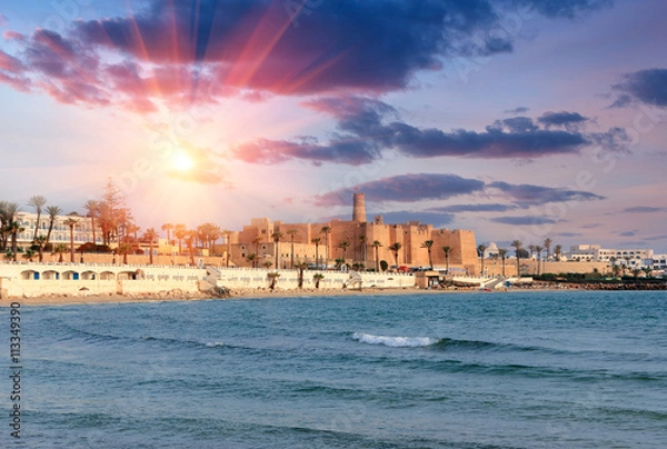 Fototapeta Beautiful view of the ancient Ribat fortress at sunset. Tunisia, Monastir. Mediterranean Sea.