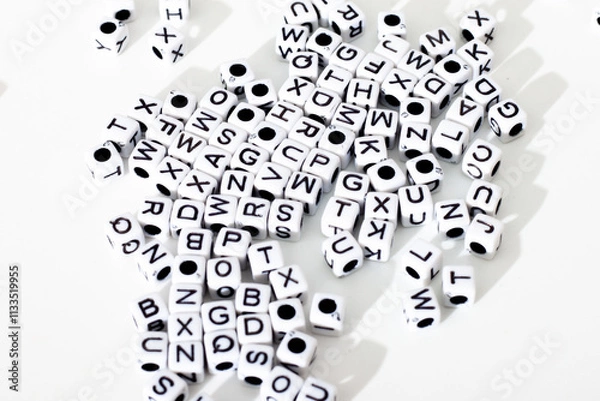 Obraz small dice with letters on a white background