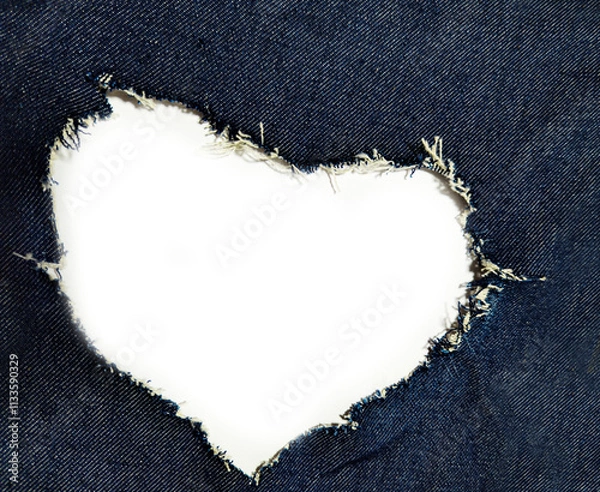 Fototapeta the heart forms an opening in the blue denim.