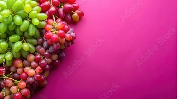 Fototapeta Fresh red and green grapes on a vibrant pink background, grapes, fresh, red, green, vibrant, pink, background, colors, fruity