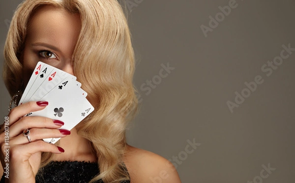 Fototapeta Four aces playing cards in woman's hand. Player with poker quads combination. Elegant female hands with red manicure