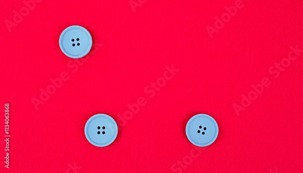 Fototapeta Pink fleece fabric with three blue buttons