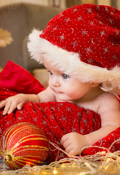 Obraz child in santa claus hat