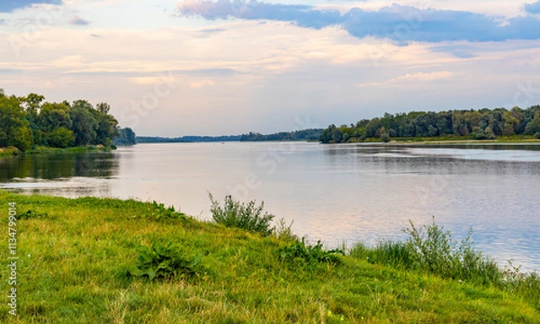 Fototapeta Vistula river landscape at summer early evening with riverside with wild beaches and embankment near Czerwinsk village in Mazovia region of Poland