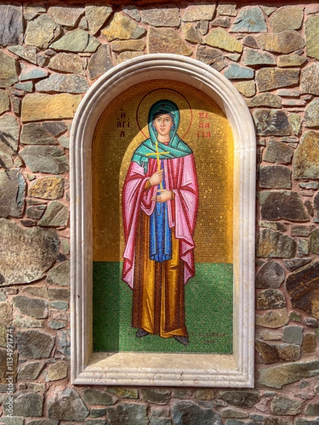 Fototapeta Milikuri, Cyprus, October 16, 2024: Mosaics in a fence along the path from Kykkos Monastery to the chapel on Throni Hill in the Troodos Mountains in Cyprus, 