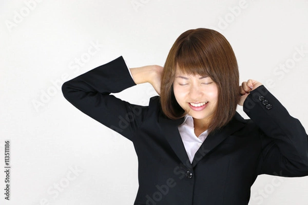 Fototapeta 背伸びをする若い女性