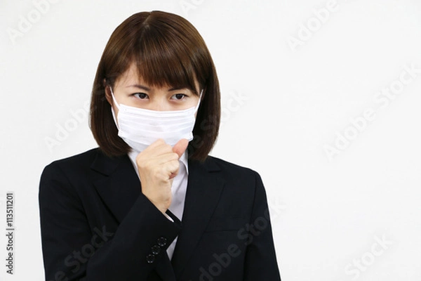 Fototapeta 咳をする若い女性