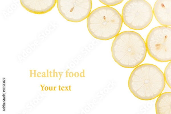Fototapeta Decorative frame from circles of lemon slices on a white background. Isolated. Decorative border.  Fruit background. Copy space.