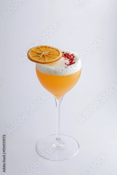 Obraz A cocktail in a wine glass, elegantly topped with a slice of orange