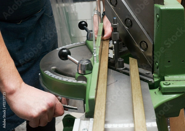 Obraz Craftsman working on frame in frameshop.