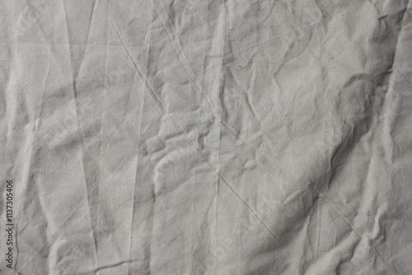 Fototapeta Wrinkled Beige Canvas Fabric Background with Natural Folds and Texture for Design and Textiles