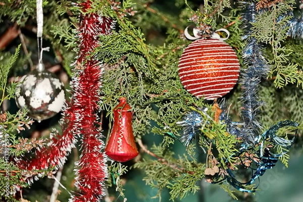 Obraz Happy New Year.Christmas tree decorations and toys for fir trees covered with snow and ice. Close-up. Merry Christmas.2024.