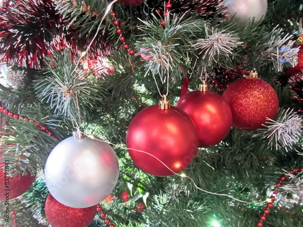 Obraz Happy New Year.Christmas tree decorations and toys for fir trees covered with snow and ice. Close-up. Merry Christmas.2024.