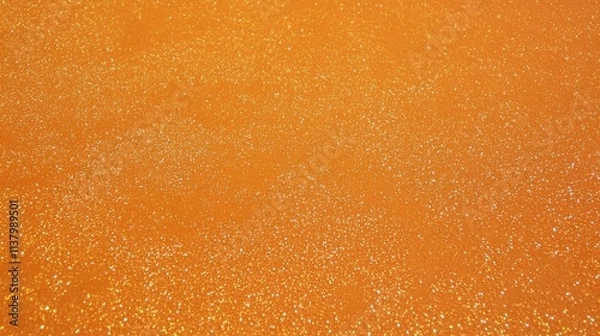 Fototapeta Stunning Orange Glitter Texture Background Design.  A captivating visual of shimmering gold glitter on an orange backdrop. Perfect for graphic design, wallpapers, and more.