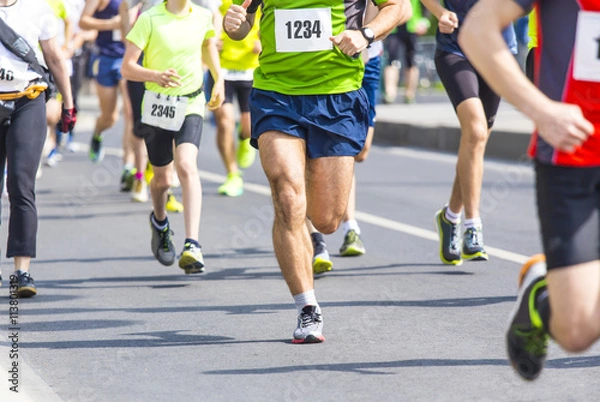 Fototapeta marathon runners with their shadows running on the street
