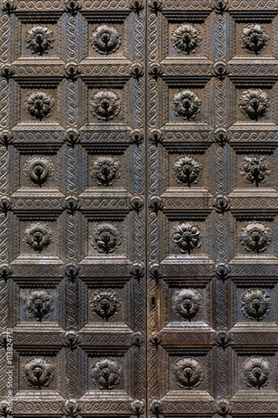 Fototapeta Medieval door of the Parma's Baptistery in Parma, Italy