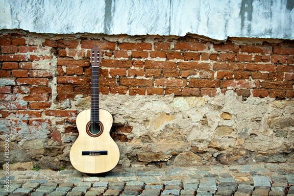 Obraz Spanish guitar on old wall, copy spaced.