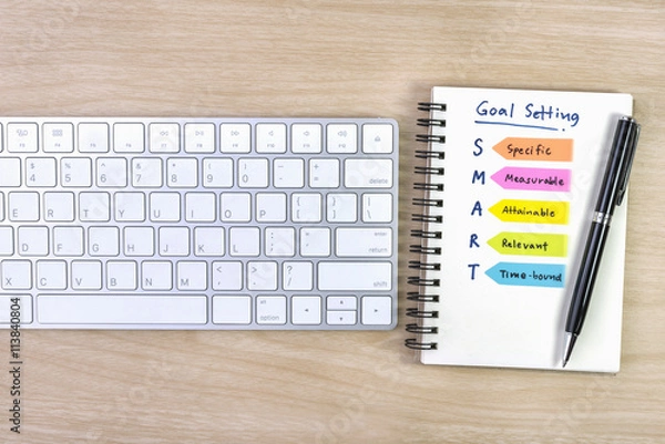Obraz smart goals setting written on the notebook with pen