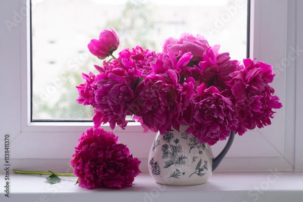 Fototapeta bouquet of peonies on the window