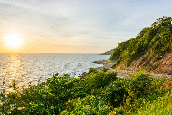 Obraz A scenery of road beside mountains and sea with the sunset time in Chanthaburi Thailand.