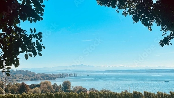Obraz Enjoying a serene lake view under clear blue skies filled with tranquility and beauty