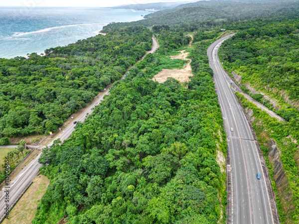 Obraz North South tool road highway St Catherine Kingston to Mammee Bay St Ann Ocho Rios Montego Bay North Coast Jamaica with lush greenery and Caribbean sea