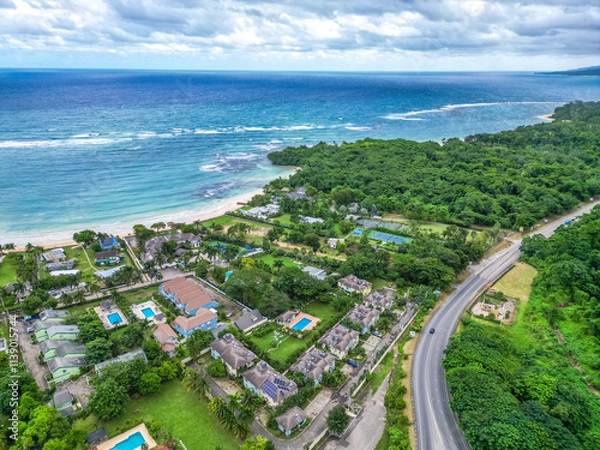 Obraz Mammee Bay Ocho Rios St Ann lush north coast aerial view of community and Caribbean sea pristine water crystal clear blue with greenery green trees pool hotels condos in Jamaica