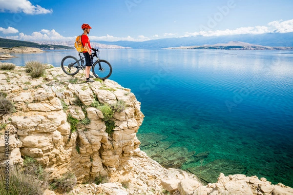 Obraz Mountain biker looking at view and sea