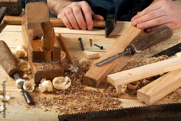Obraz Carpenter tools on wood table background. Top view. Copy space