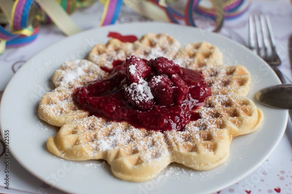 Fototapeta homemade heart waffle on a white plate with fresh made raspberry compote