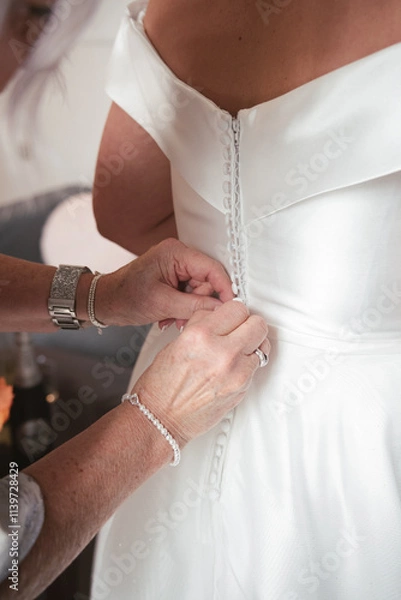 Obraz A bride getting her final adjustments 