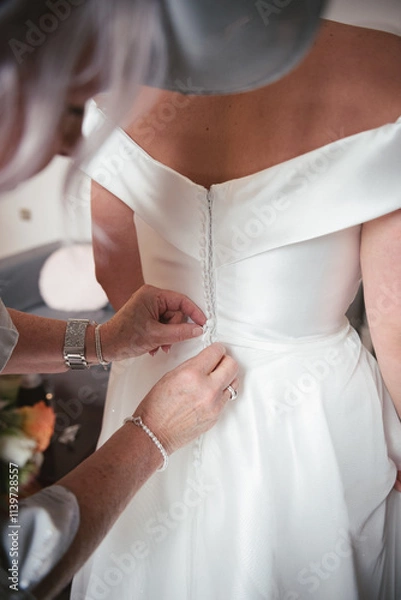 Obraz A bride getting her final adjustments 