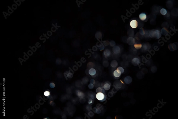 Fototapeta black with light bokeh 