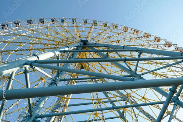 Fototapeta View of the Ferris wheel from an unusual angle