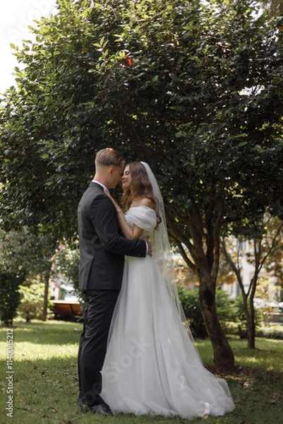 Fototapeta Beautiful and Elegant Wedding Ceremony in a Stunning Lush Garden Setting Outdoors