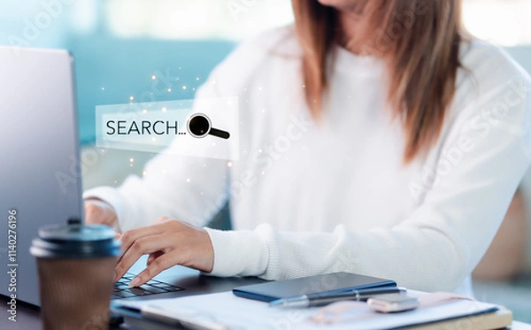 Obraz businessman,typing on keyboard,with search box on virtual screen, hologram, searching for information on internet,online reference, deep research of information from all over the world,search engine.