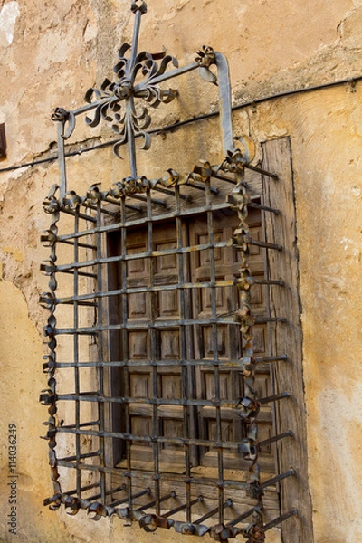 Obraz old window with an old fence protection