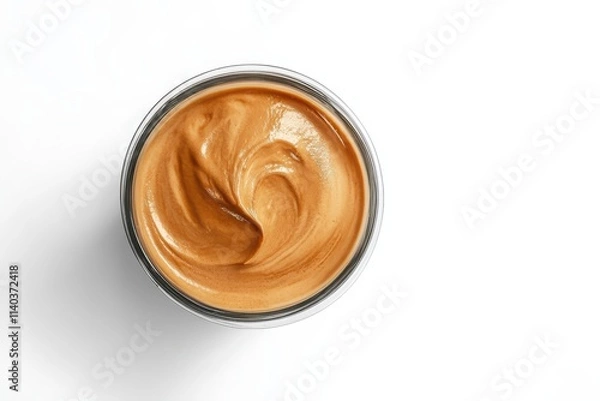 Fototapeta Stylish dalgona coffee in a glass casting a shadow on a white backdrop representing iced and whipped Korean coffee