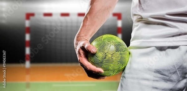 Obraz Kompozytowy obraz Sportsman trzymający piłkę