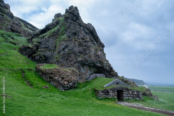 Fototapeta Historic Turf House Nestled at the Foot of a Rugged Extinct Volcano