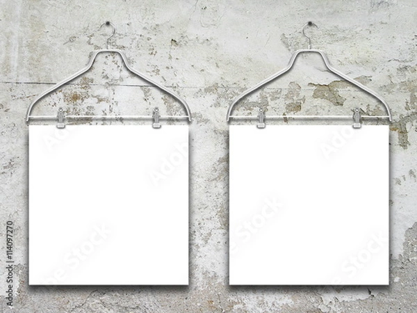 Obraz Close-up of two square blank frames hanged by clothes hanger against gray weathered concrete wall background